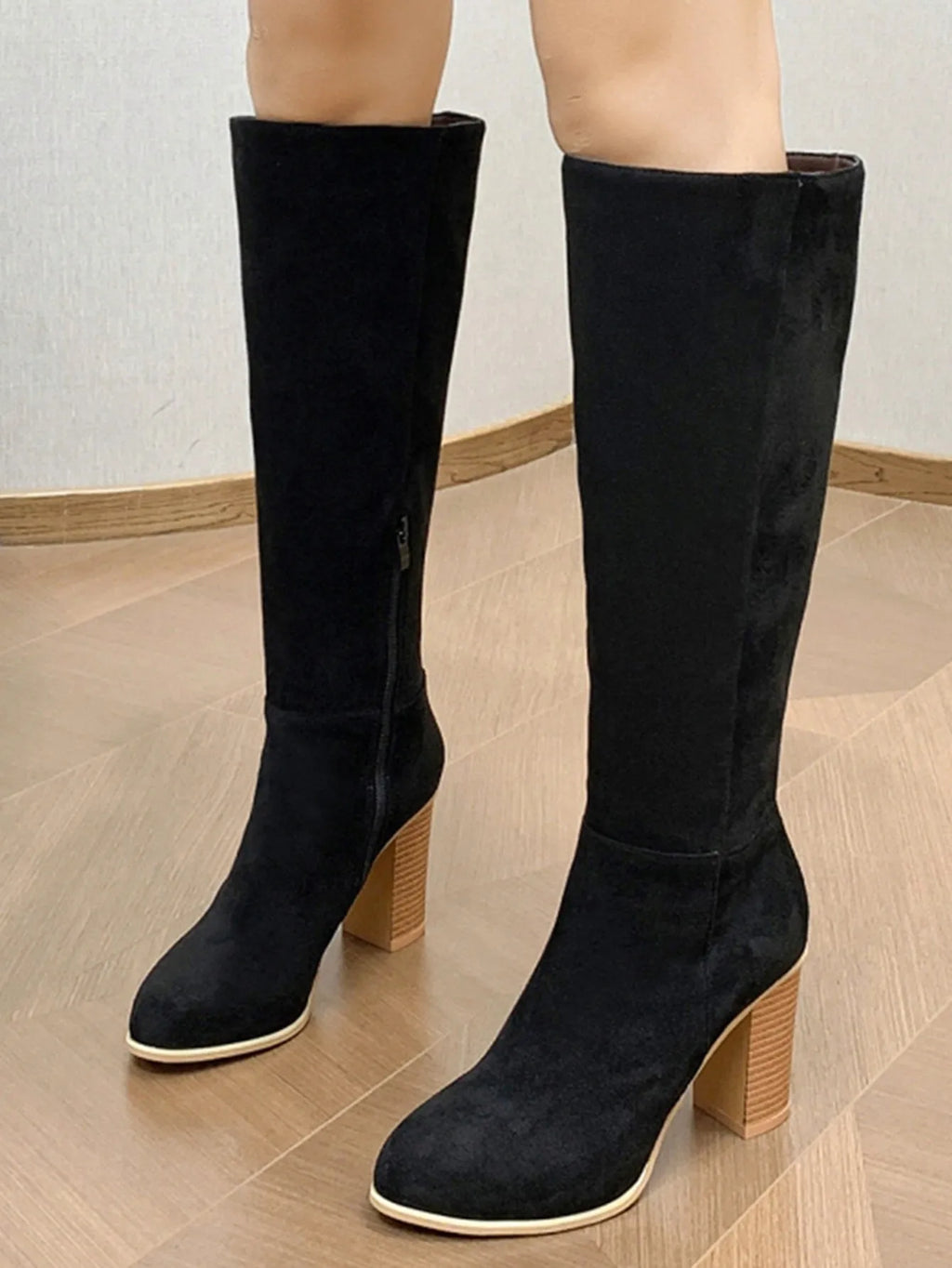Women's black square toe high heel fashion boot made of synthetic PU.