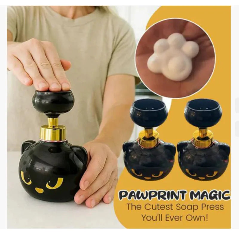 Black plastic cartoon cat-shaped foam soap extrusion dispenser on a bathroom countertop.