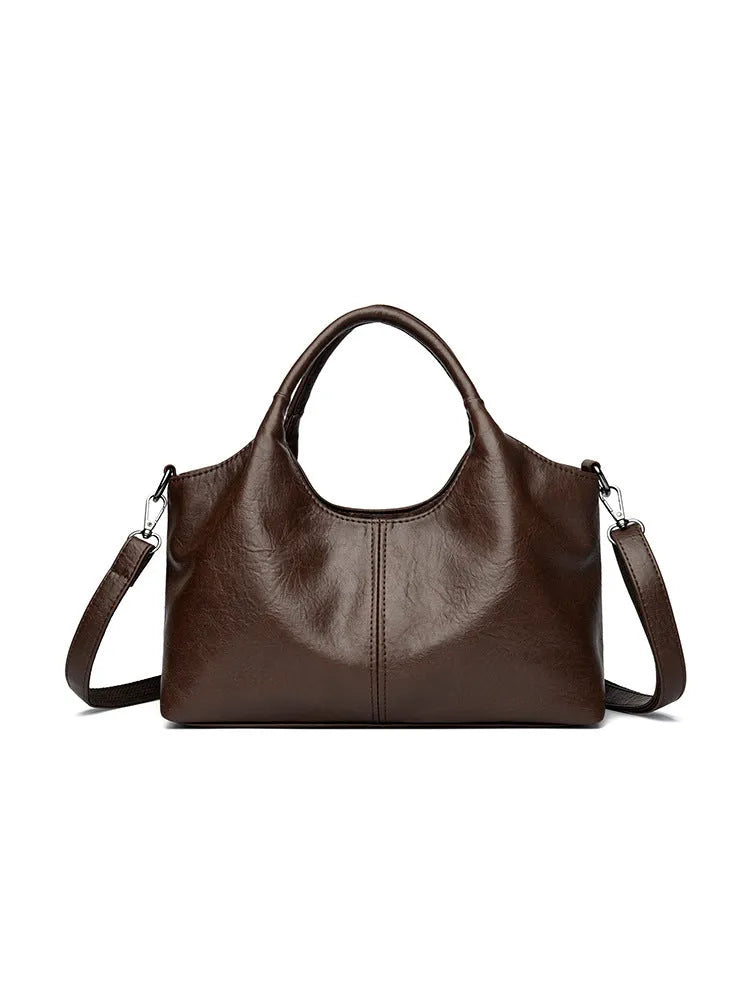 Genuine leather women's cross-body bag in black with soft texture and large capacity design