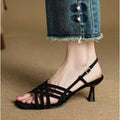Light brown women's retro sandals with thin cross straps, ankle buckle, and a square toe on a mid heel.