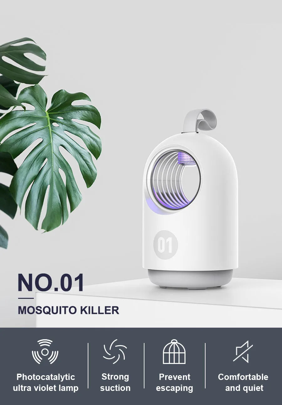 White indoor mosquito killer lamp with blue UV light and a top carry handle on a table
