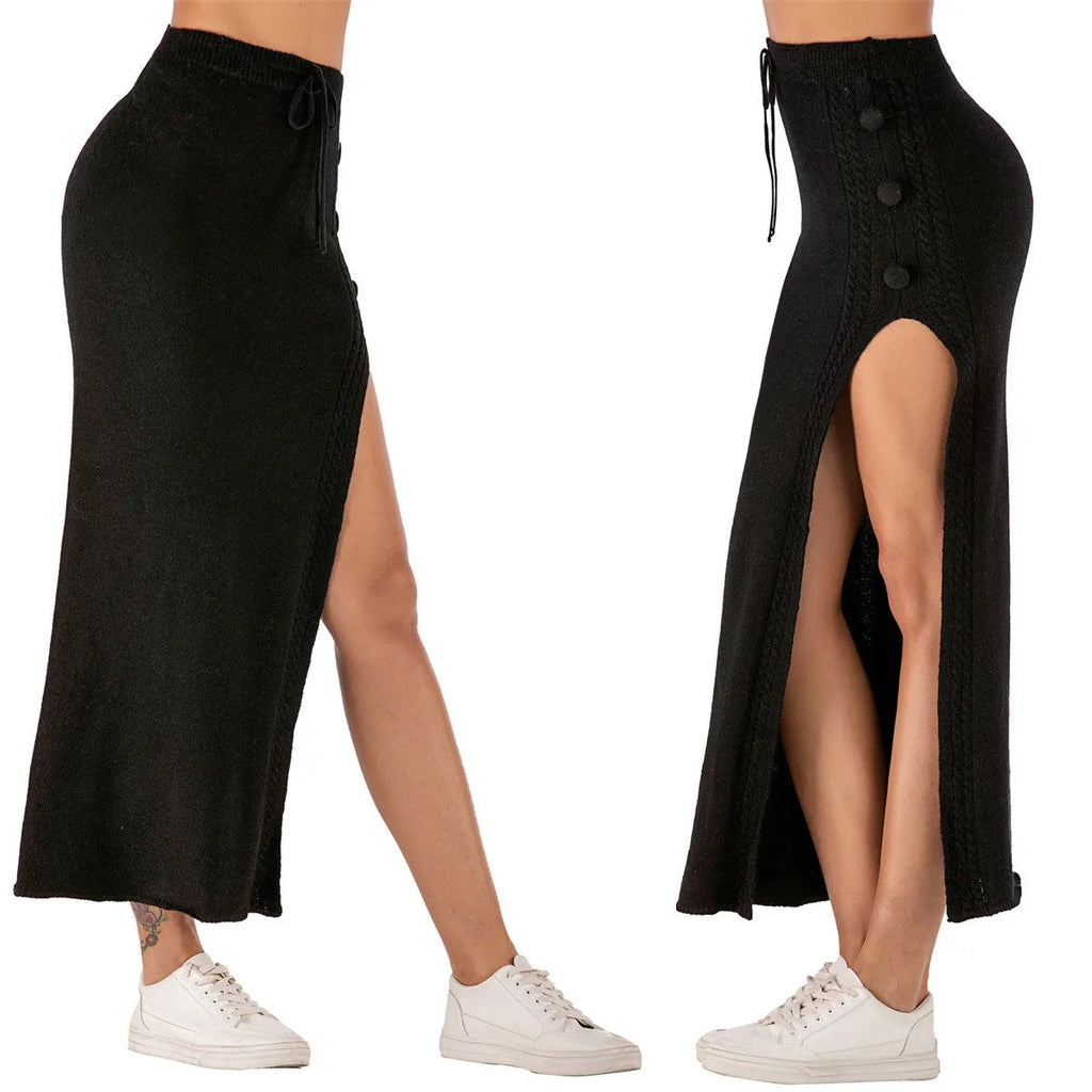 Women's slim-fit black midi skirt with a side slit, made from acrylic fabric on a model.