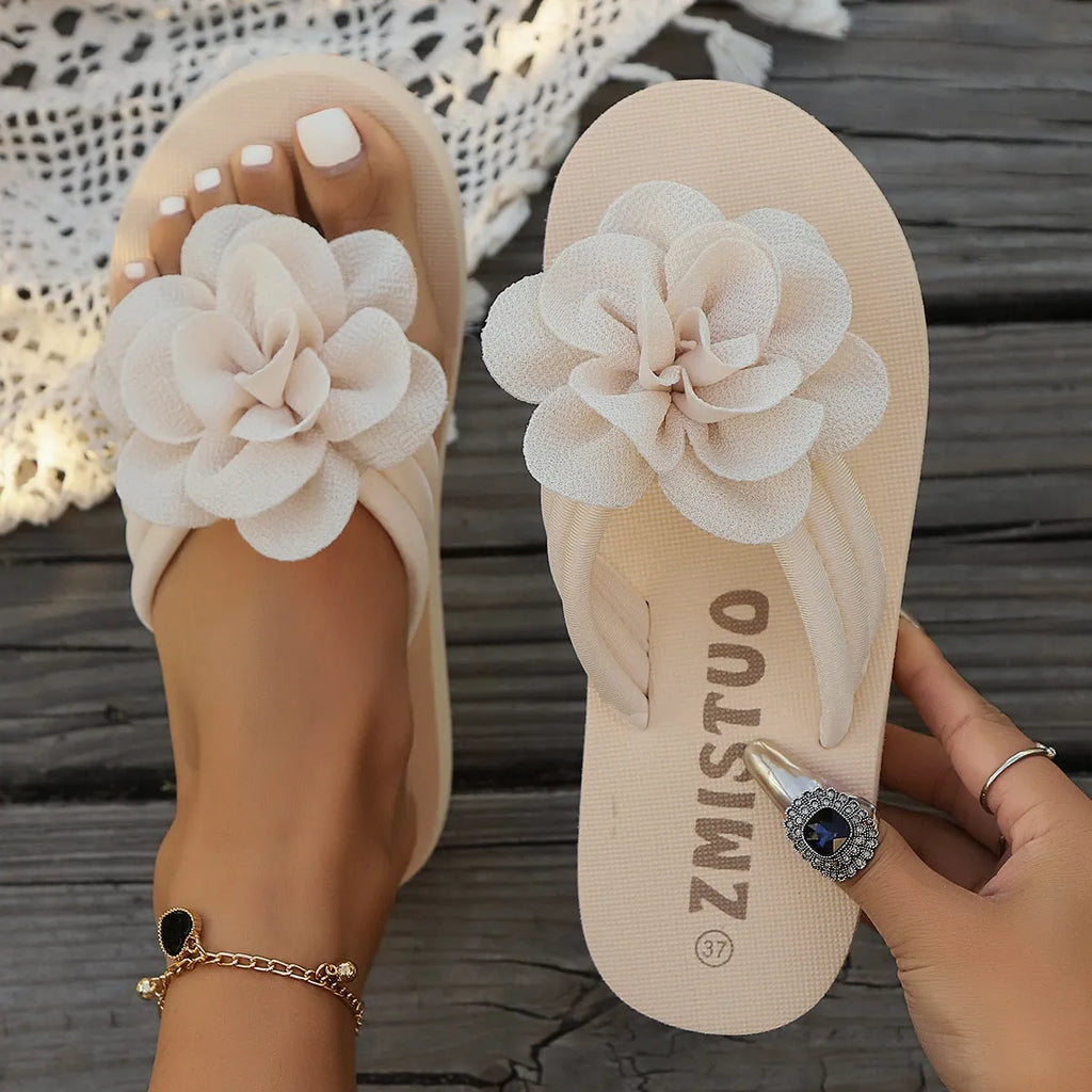 Plus size floral slipper in solid colour with round toe and flip flop style.