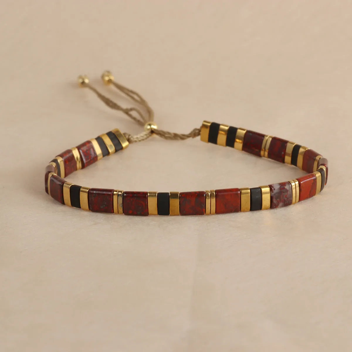 Glass and coloured glaze beaded bracelet with geometric round beads in five colour options