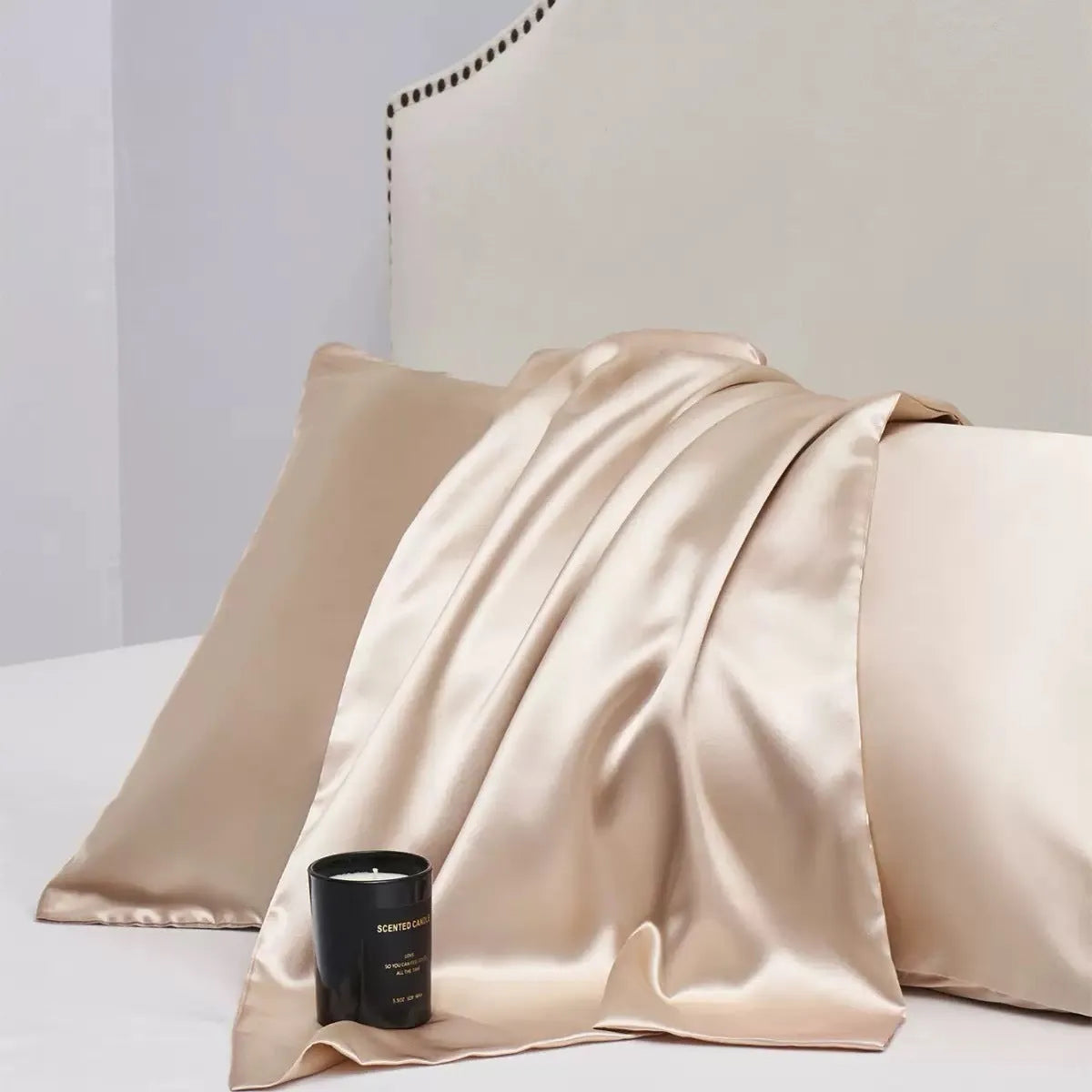 A pair of solid colour satin pillowcases in a chosen shade, showing the smooth plain weave fabric texture.