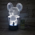 Black koala-shaped LED night light on a table showing multi-colour glow option.