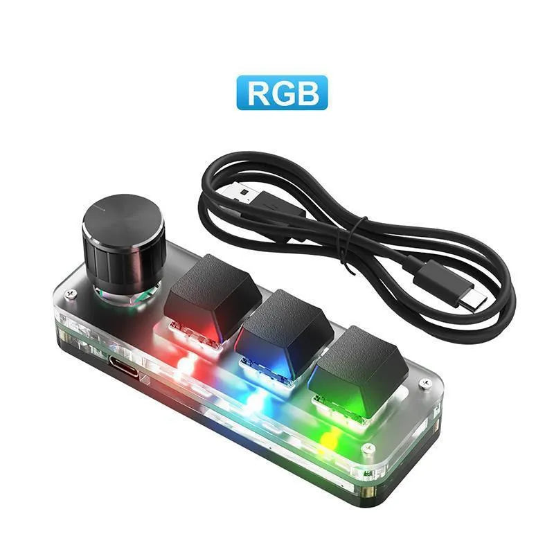 Black custom keypad with RGB backlit keys for copy and paste functions on a desk