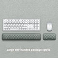 Memory foam mouse wrist rest pad with silicone base in black cloth cover option on desk