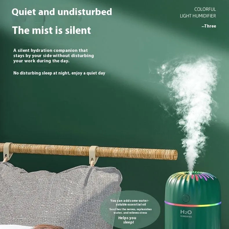 Small green animal-shaped USB aromatherapy humidifier with compact plastic build.