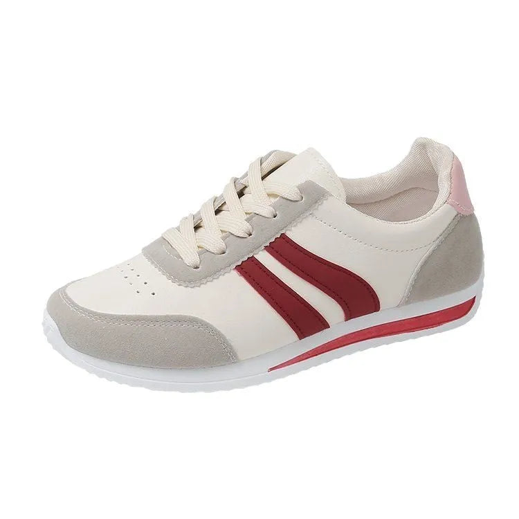 Red and blue low-top lace-up running sneakers on a white background.