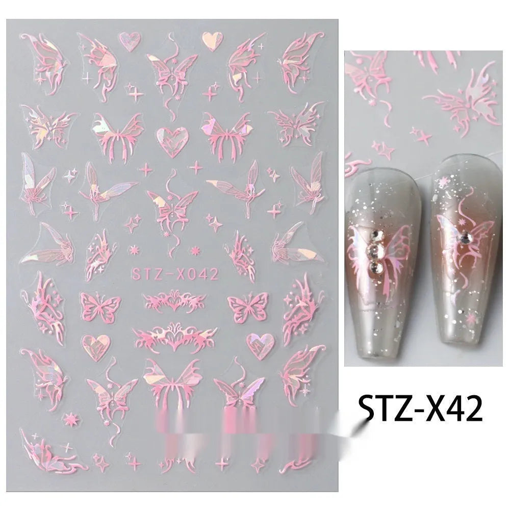 Close-up of a cartoon-style nail sticker with black and silver strips and a love pattern design on a fingernail.