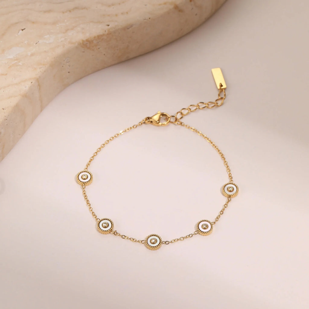 Geometric fritillary design stainless steel bracelet with 18K gold plating and matching necklace