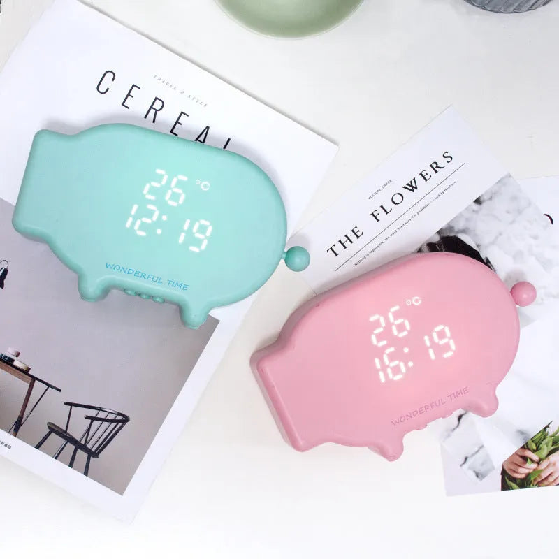 Multifunctional LED alarm clock with temperature display and USB charging port in blue or pink