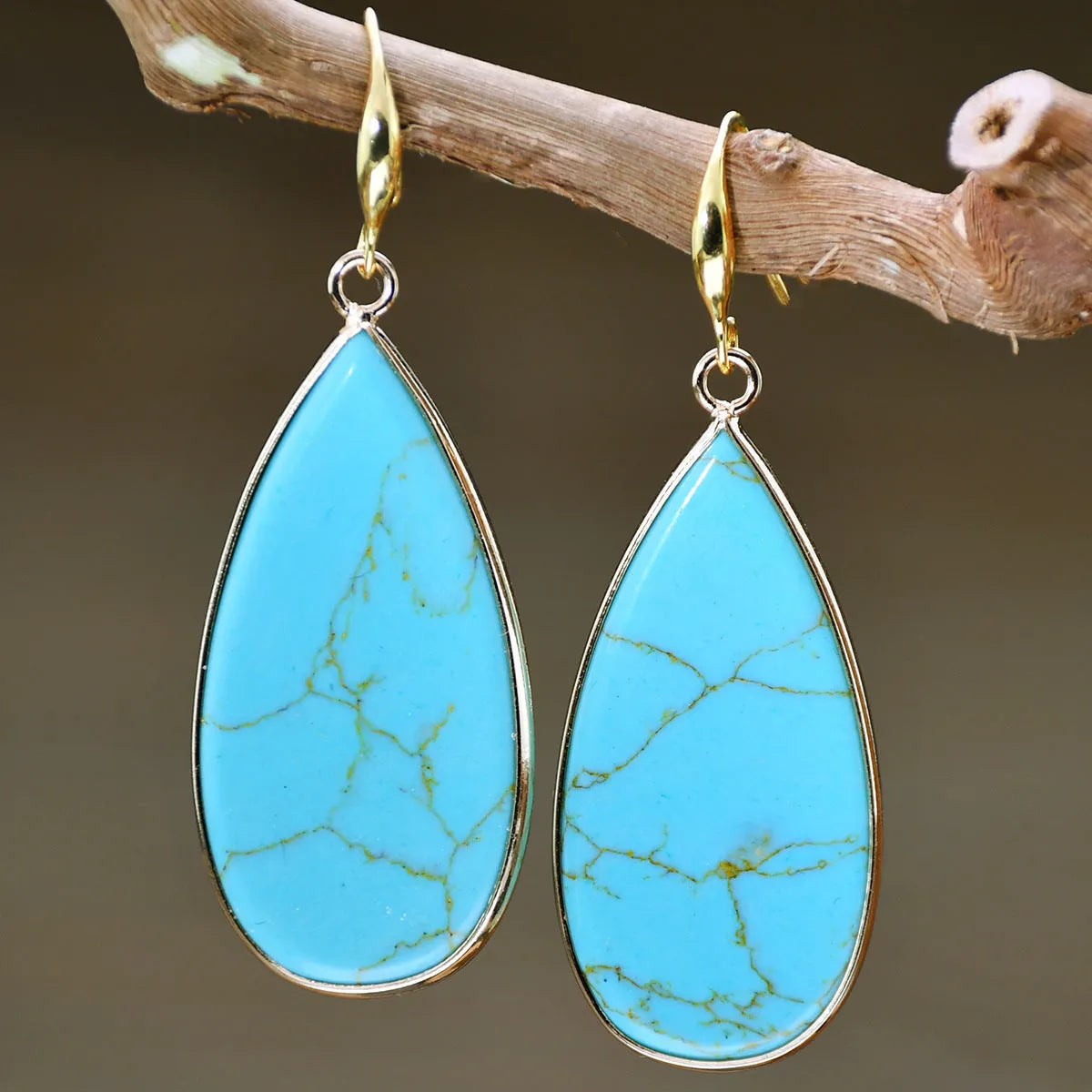 Vintage tigereye stone drop earrings with elongated water drop shape and textured elements