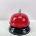 Iron game bell in one of ten colours: red, green, blue, pink, yellow, or other variants.