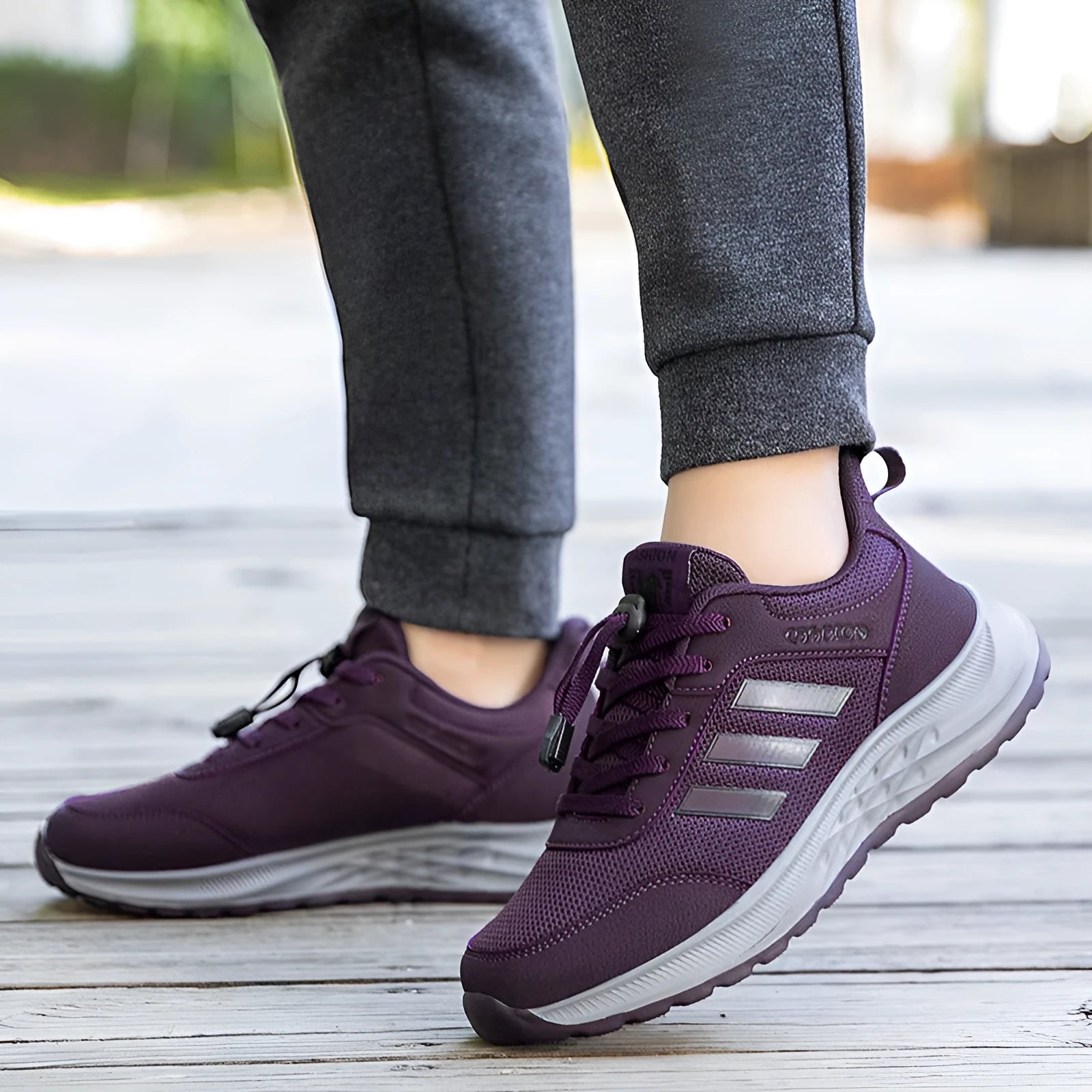 Casual unisex slip-on shoe with mesh upper and black elastic band fastening on a non-slip sole.