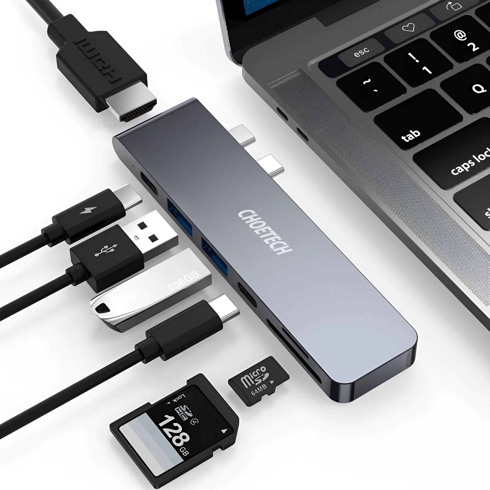 Compact aluminium USB-C hub adapter with SD card slot, microSD slot, two USB ports, HDMI, and charging port.
