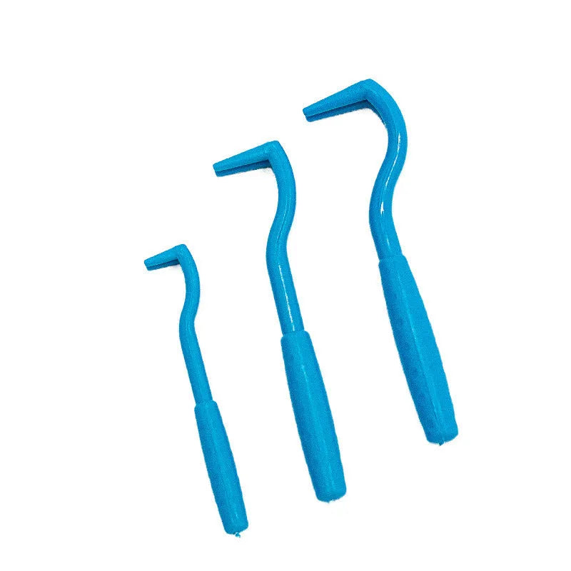 Three blue plastic tick removal clips for dogs and cats on a white background.