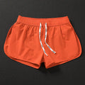 Men's loose fitting beach surfing trousers in polyester available in fluorescent green, orange red and black colours