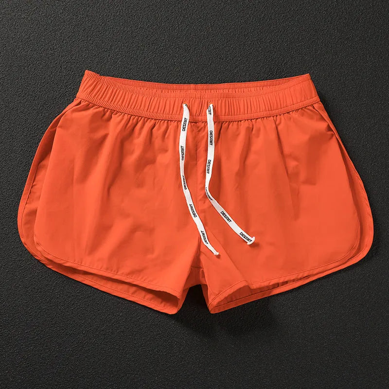 Men's loose fitting beach surfing trousers in polyester available in fluorescent green, orange red and black colours