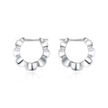 Pair of geometric sterling silver earrings with circular design element and electroplated finish