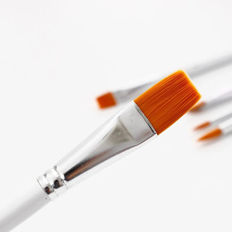 Set of six artist paint brushes with wood handles and synthetic nylon hair on a white background.
