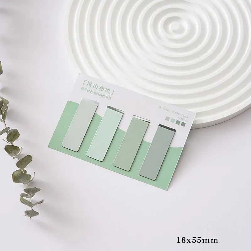 Set of four Morandi Series pastel colour-block magnetic bookmarks on a book page.