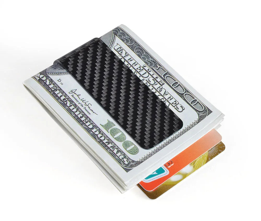 Black genuine carbon fiber money clip with striped glossy surface on a plain background