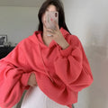 Women's loose mulberry silk hooded sweater in solid watermelon red, sleeveless design.