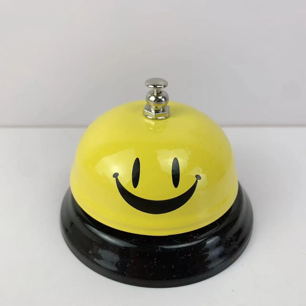 Iron game bell in one of ten colours: red, green, blue, pink, yellow, or other variants.