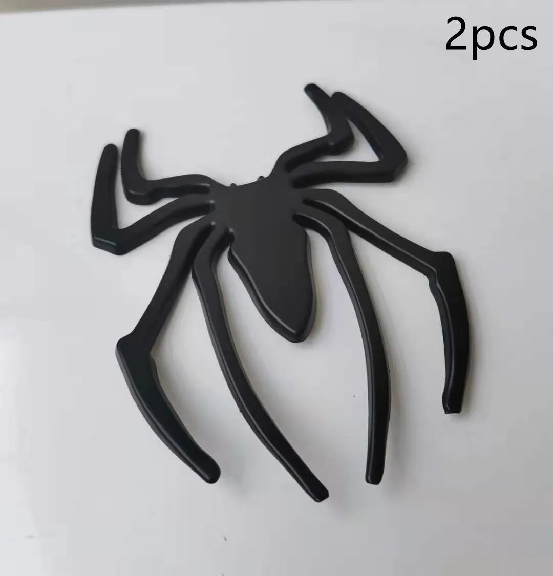 Three-dimensional metal spider bumper sticker in zinc alloy, showing detailed design