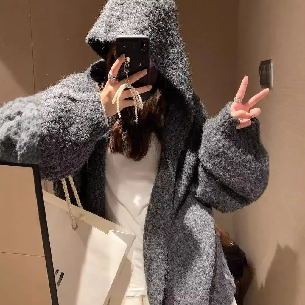 Women's dark grey retro Maillard knit hooded cardigan on a hanger, showing loose fit and regular sleeves.