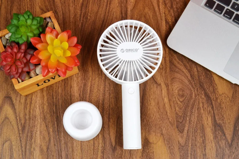 White portable USB desk fan with rechargeable battery, showing three-speed controls and compact design