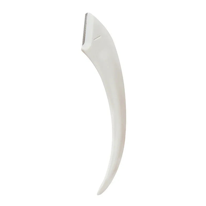 Close-up of a curved moon-shaped eyebrow trimming knife with a comb, in pink and white colours.