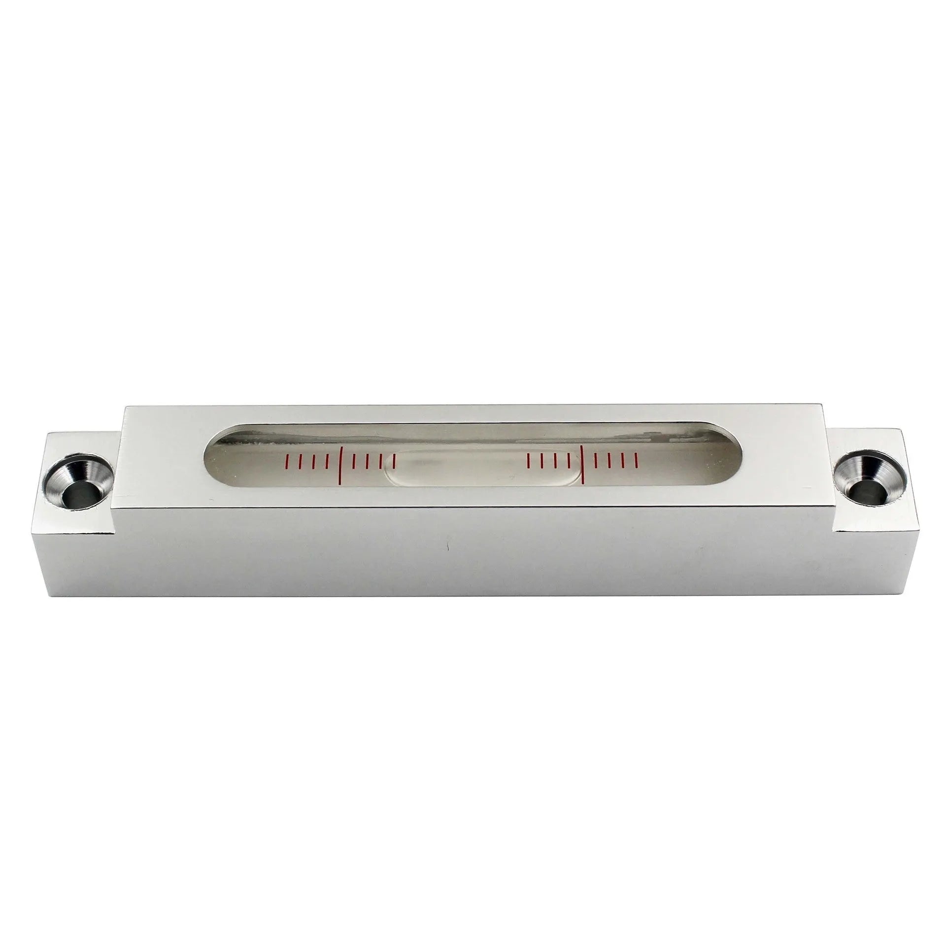 Small silver metal spirit level with glass vials on a workshop bench