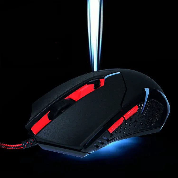 Black and red USB wired gaming mouse with six buttons and adjustable DPI settings on a desktop.