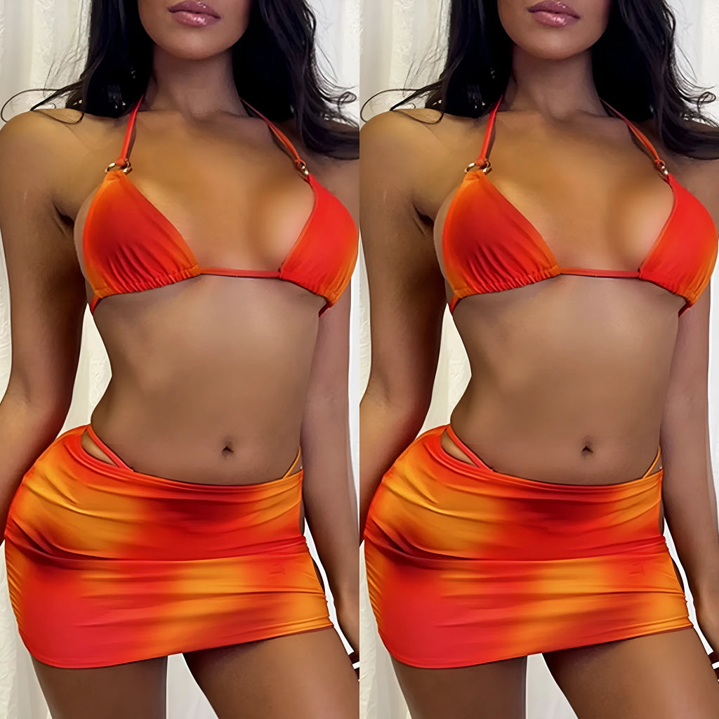 Solid colour tie-dye halter top three-piece bikini set with skirt on a mannequin.