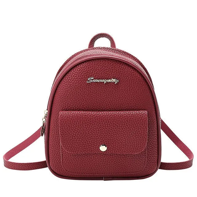 Solid colour PU leather women's small shoulder backpack with zipper, shown in available colours.