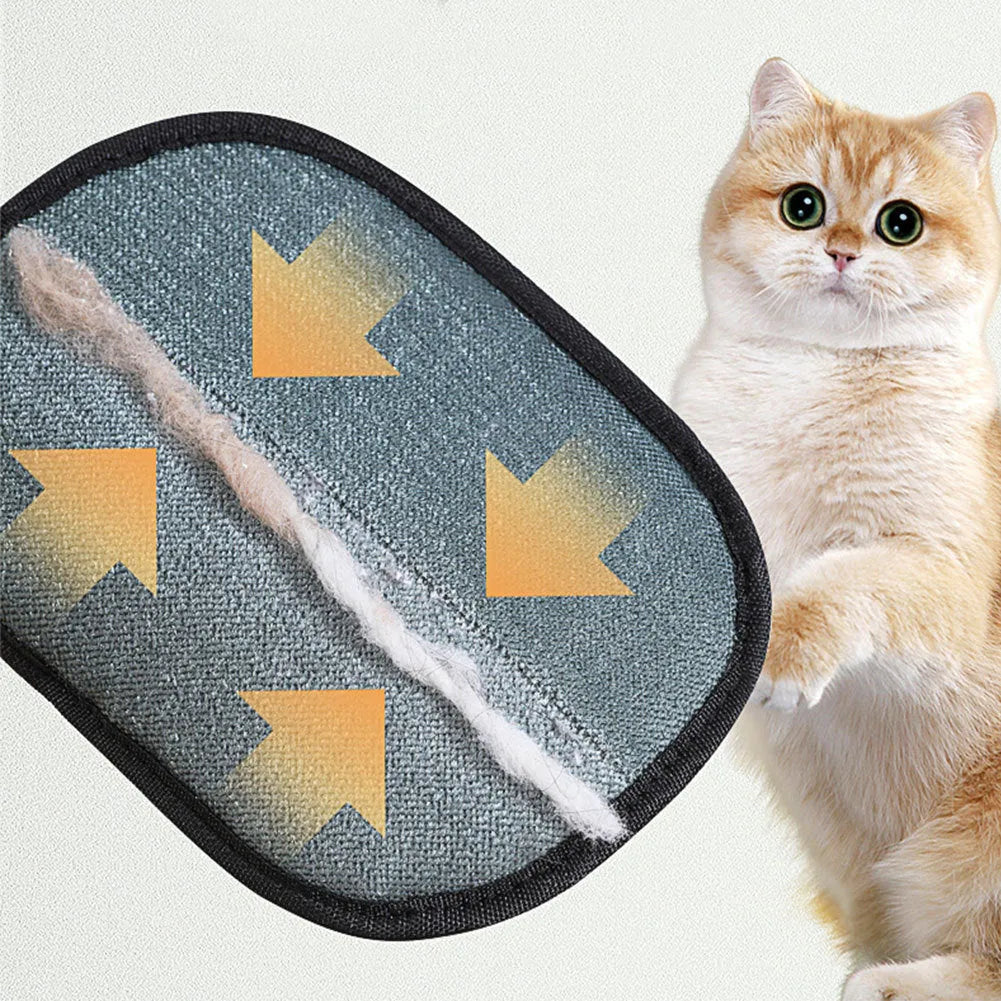Black pet hair removal glove with silicone bristles, shown on a hand grooming a dog.