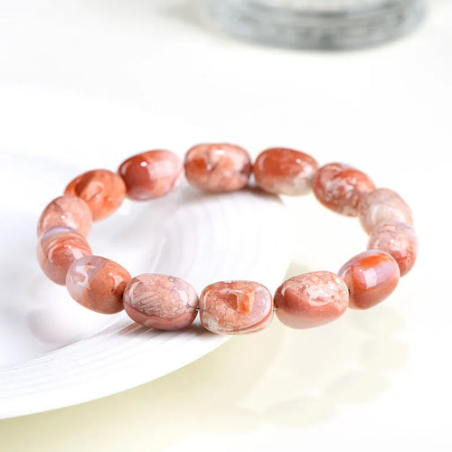 Natural cherry blossom agate barrel bead bracelet with 10mm by 14mm geometry design and ruyi element