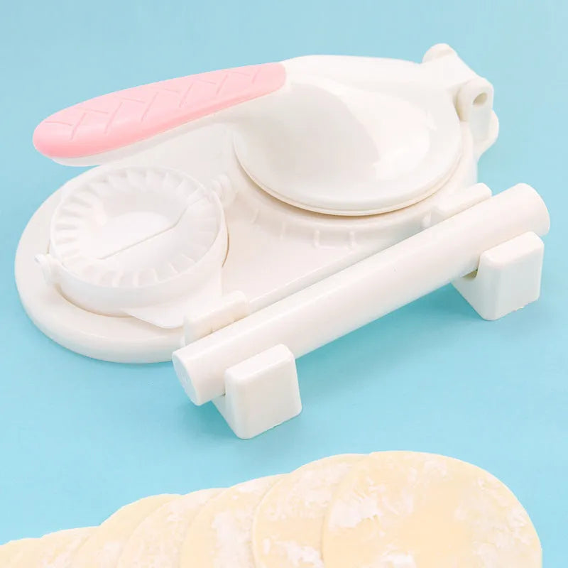 3 in 1 plastic dumpling maker with ergonomic handle and rolling pin in white on a table