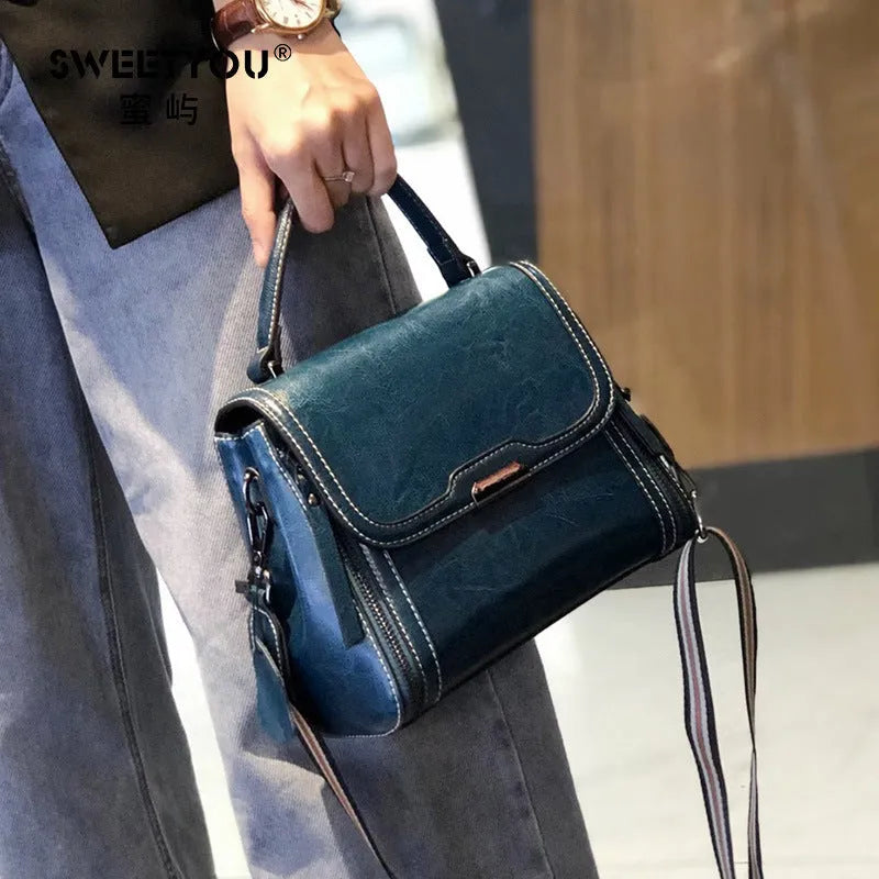 Genuine leather women's messenger bag in horizontal square shape with multiple pockets and double shoulder straps