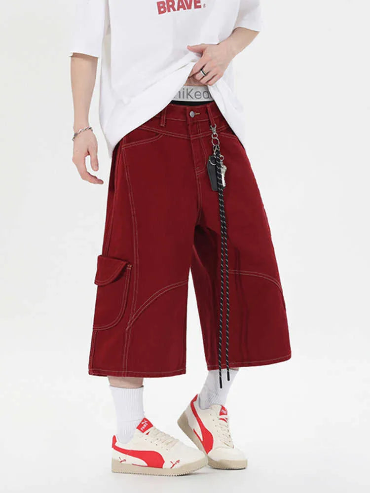 Retro denim workwear shorts with wide leg cut and multiple pockets in red colour
