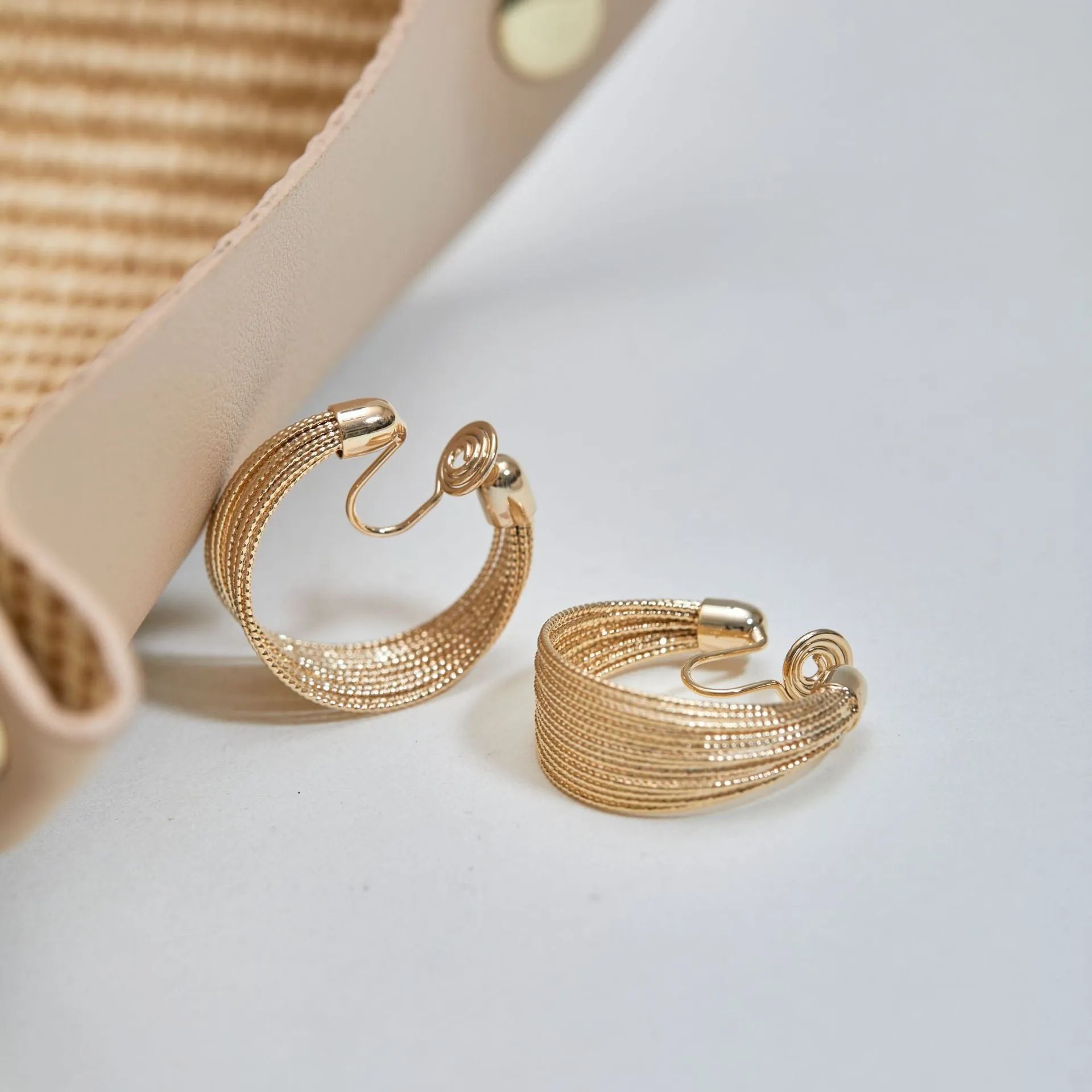 Copper geometric multi-layer bracelet earrings in silver or gold finish, available as clip-on or stud styles