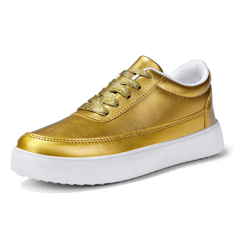 Women's white leather flat casual shoes with lace-up front on a plain background.