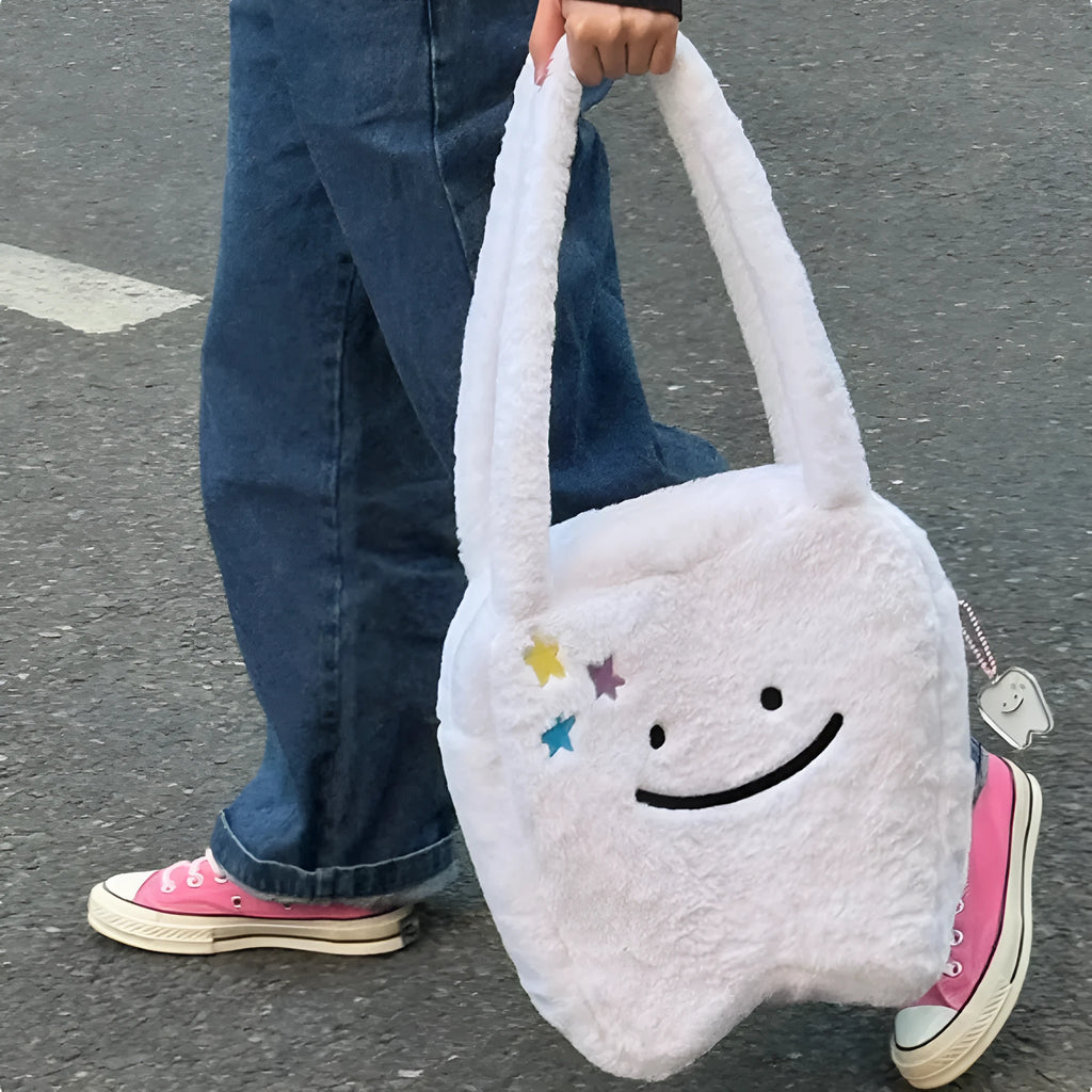 White plush shoulder tote bag with cute tooth design and zipper closure