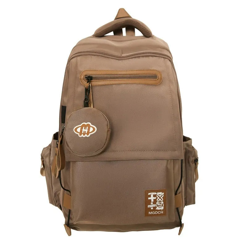 Large nylon backpack for middle school students with curved shoulder straps in solid colour options