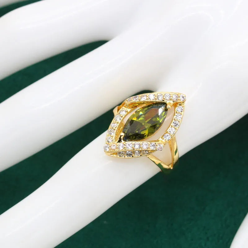 Olive green anti-allergy AAA zircon jewellery set with necklace, ring, bracelet, and earrings on display