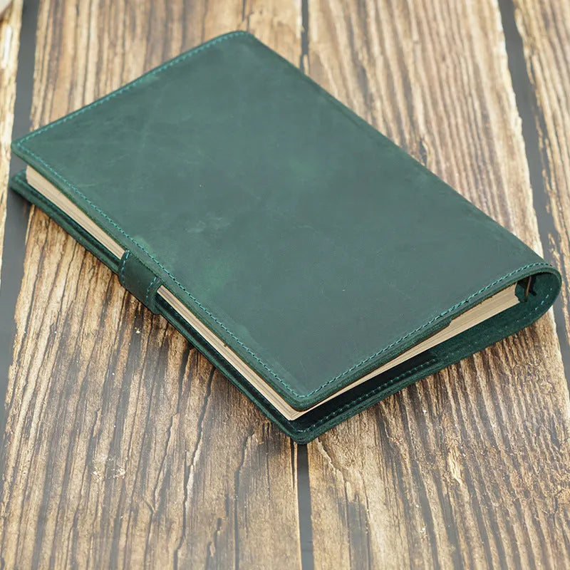 A5 handmade cowhide notebook with genuine leather cover in Crazy Horse Brown, opened on a table