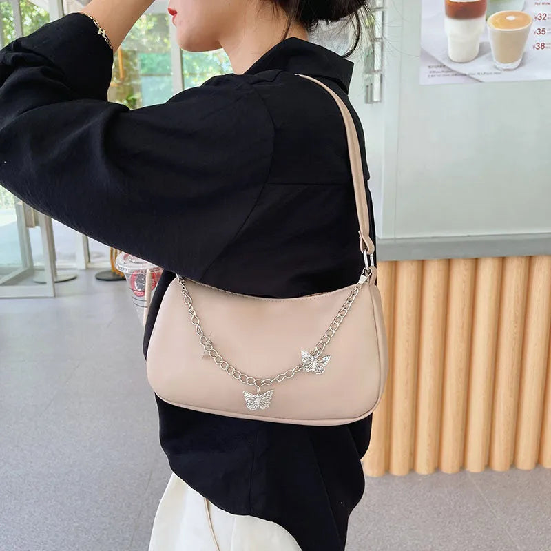 PU leather retro chain underarm bag in horizontal square shape showing crossbody strap and organised interior.